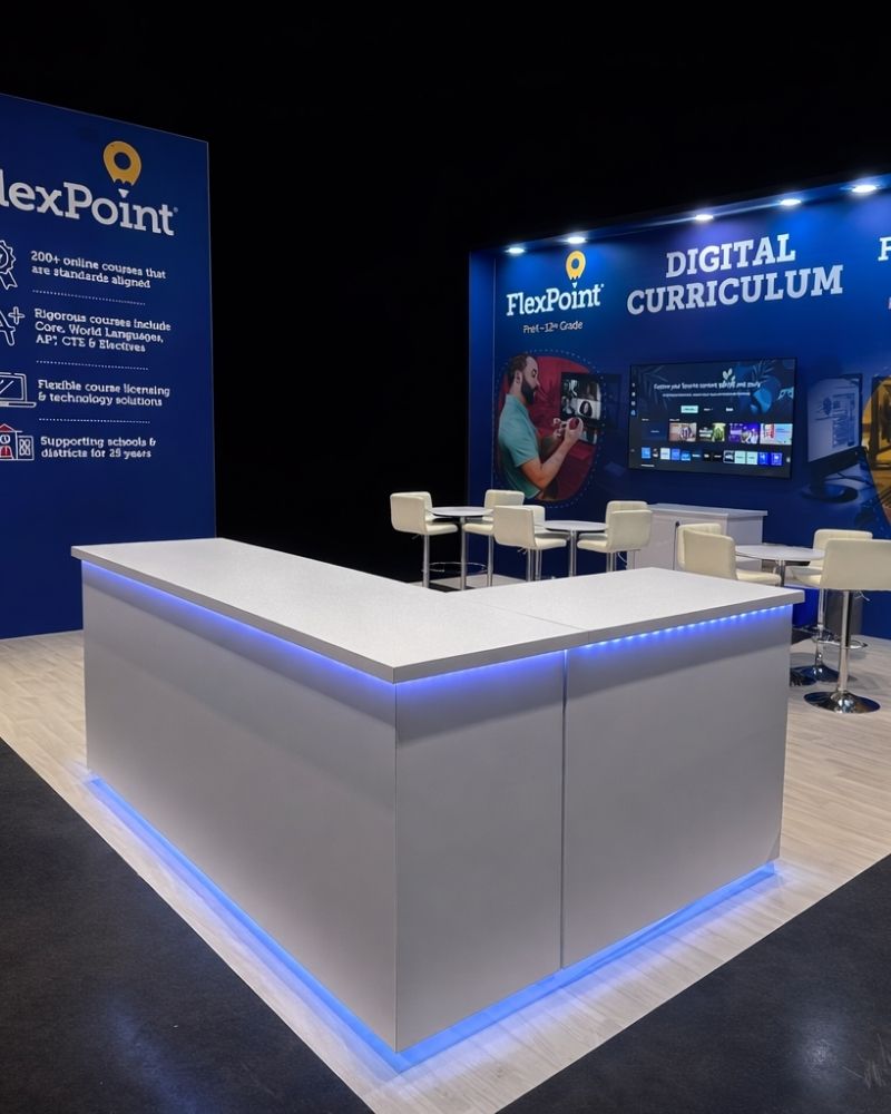 FlexPoint trade show booth with digital curriculum display and branded counter by Local Exhibits