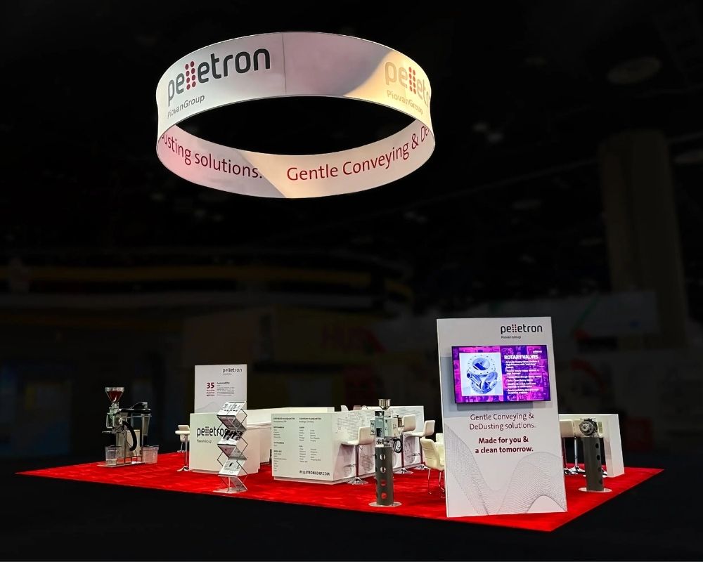 Pellettron trade show booth with industrial product displays and overhead signage by Local Exhibits