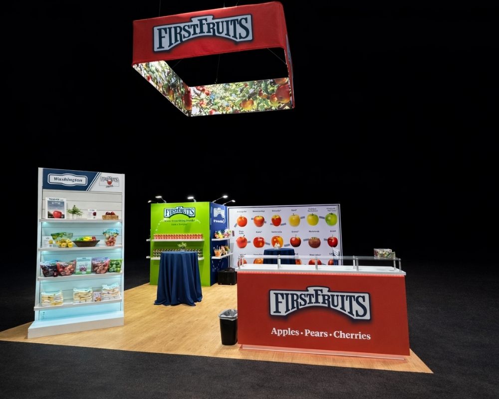 FirstFruits branded trade show booth with fruit displays and product counters by Local Exhibits