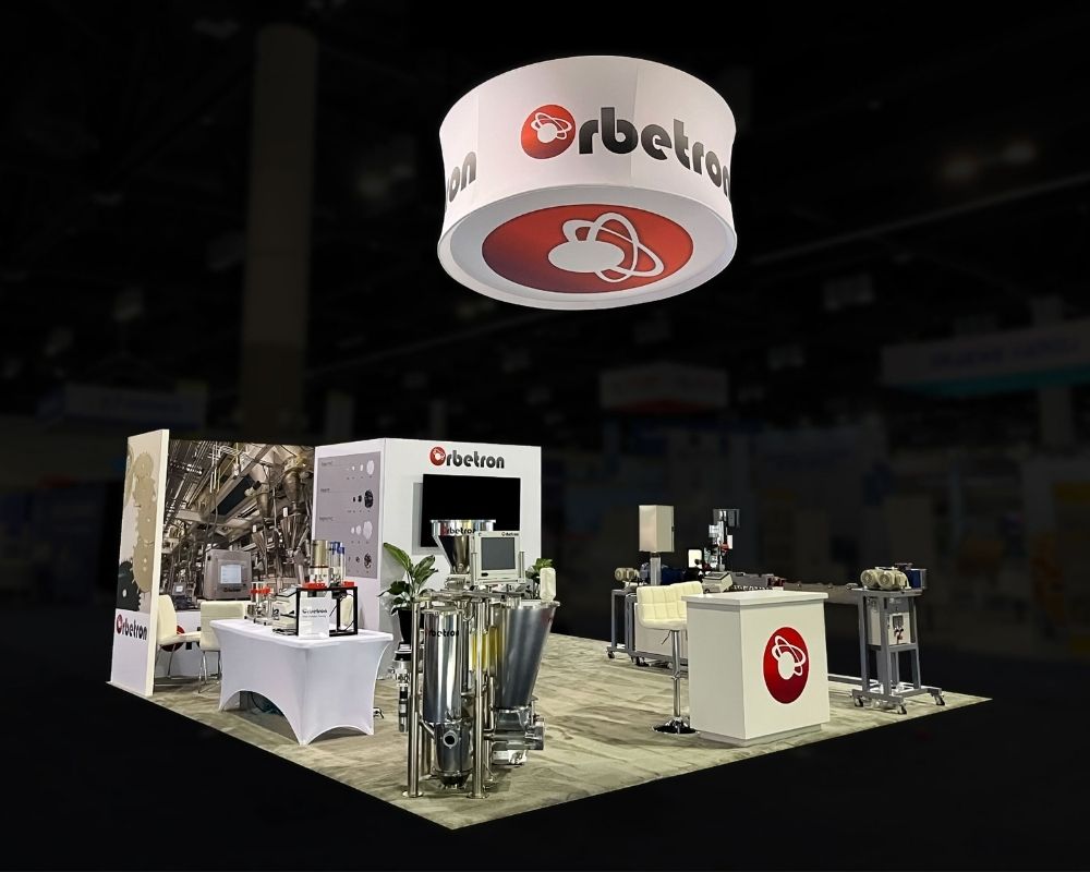 Orbetron custom trade show booth with industrial equipment and branded signage by Local Exhibits