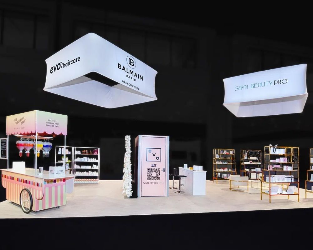 Evo Haircare, Balmain Paris, and Sayn Beauty Pro custom trade show booth with branded displays by Local Exhibits