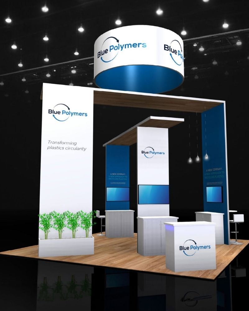 Blue Polymers custom trade show booth with overhead hanging sign and clean branded display by Local Exhibits
