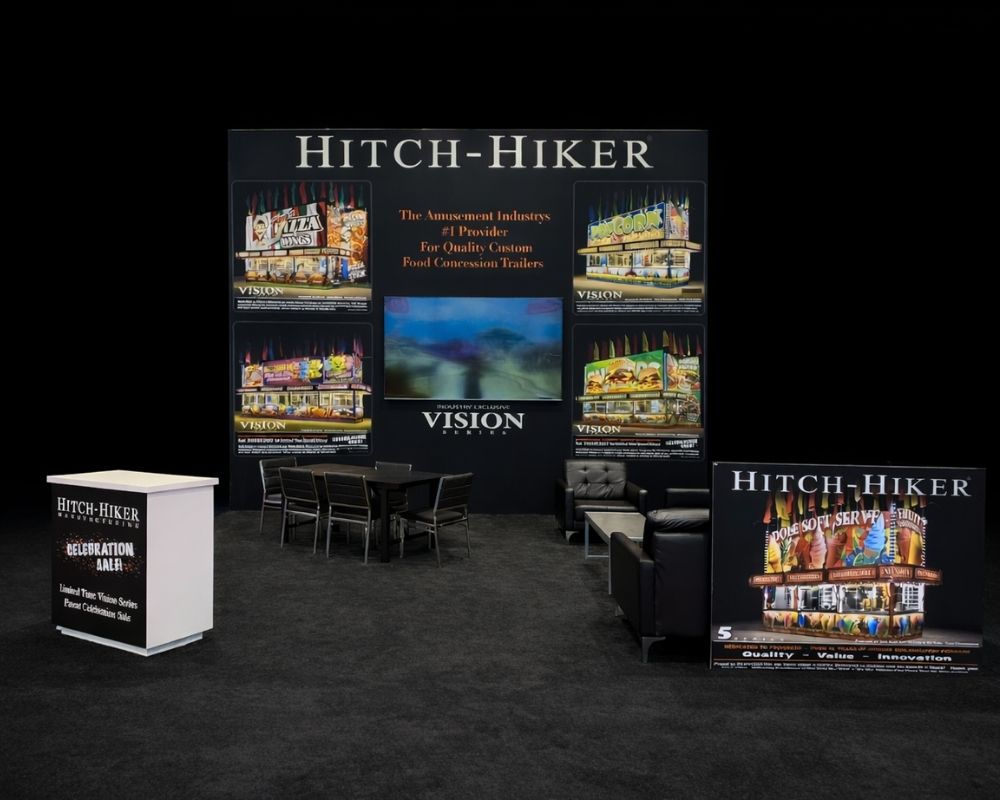 Hitch-Hiker branded trade show booth with display panels and seating area by Local Exhibits