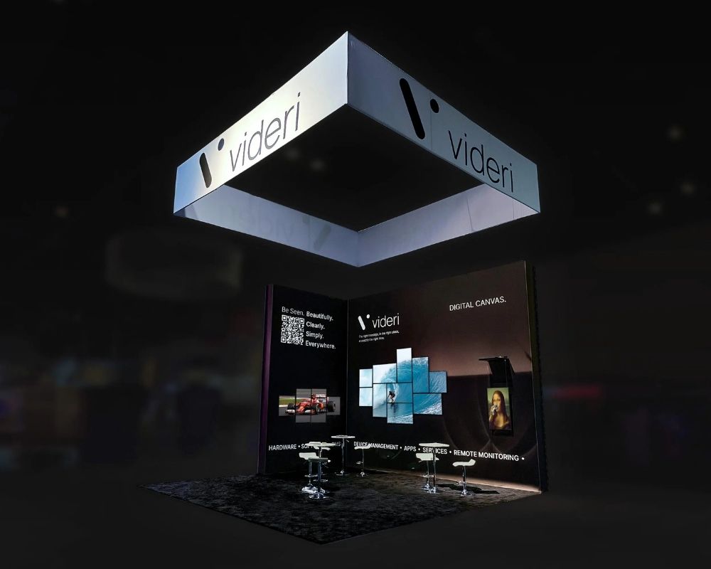 Videri custom trade show booth with illuminated overhead signage and digital displays by Local Exhibits