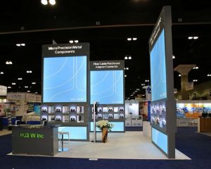 HJ3 W Inc custom trade show booth with illuminated product displays by Local Exhibits