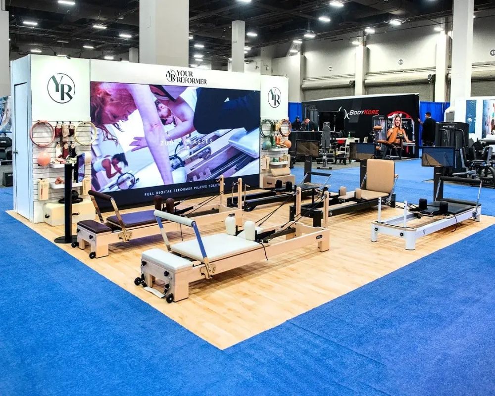 Custom trade show booth design and fitness equipment display by Local Exhibits.