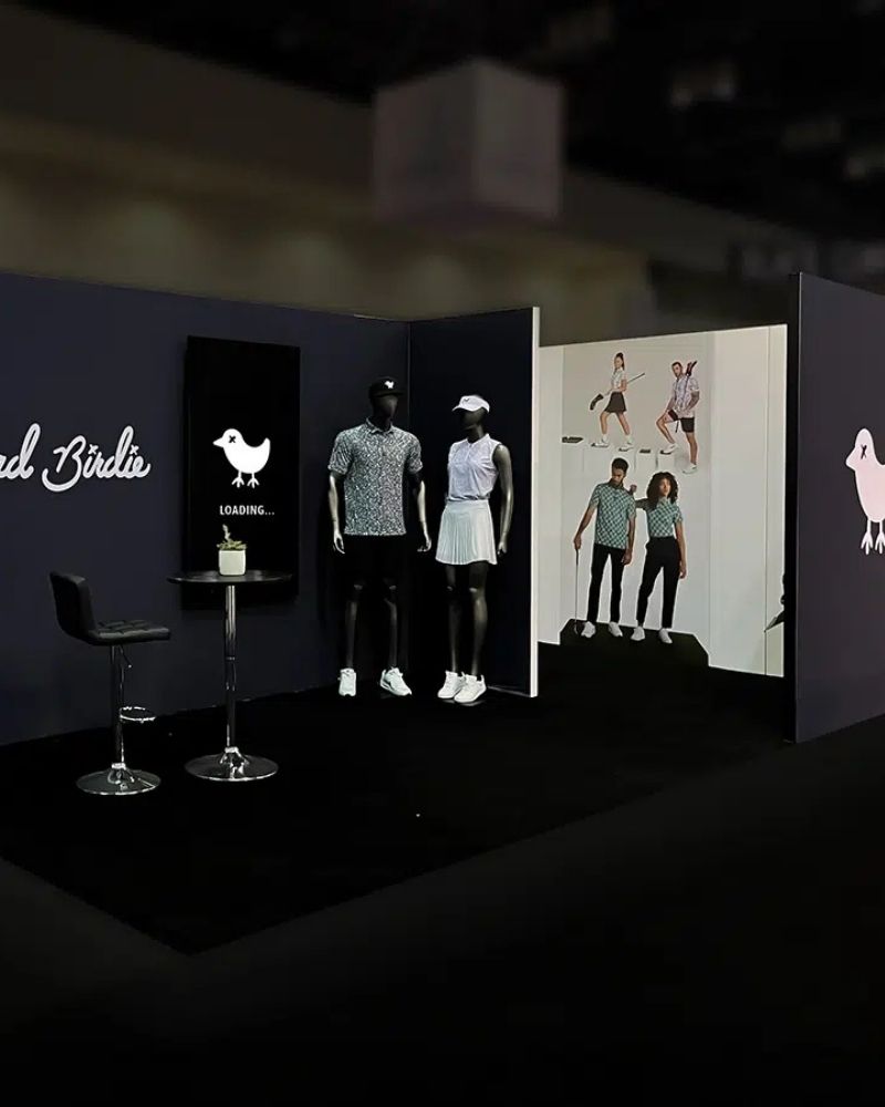 Bad Birdie custom trade show booth with apparel displays and interactive visuals by Local Exhibits